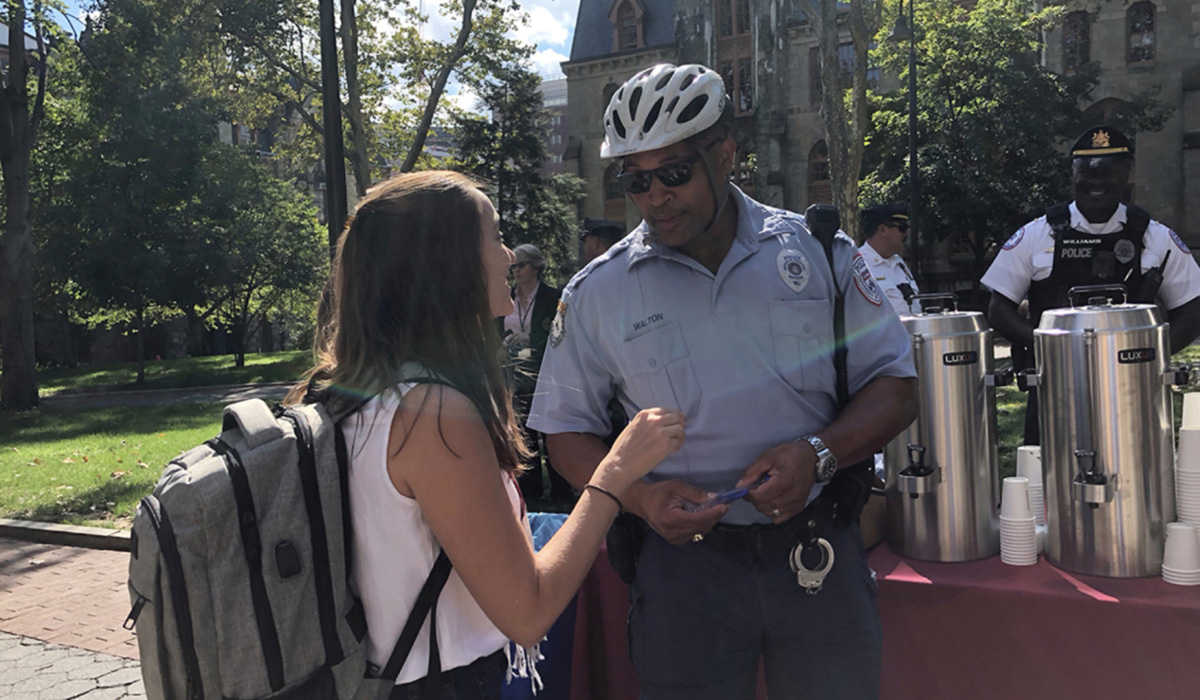 Police Officer chatting with a student