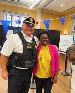 A police Lieutenant and Sergeant pose at the student resource fair.