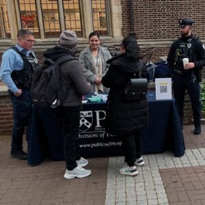 Public SAfety personnel talk with pedestrians on Locust walk