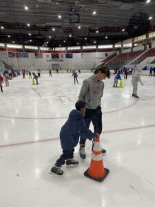 Photo of participants skating inside the Penn Ice Rink 