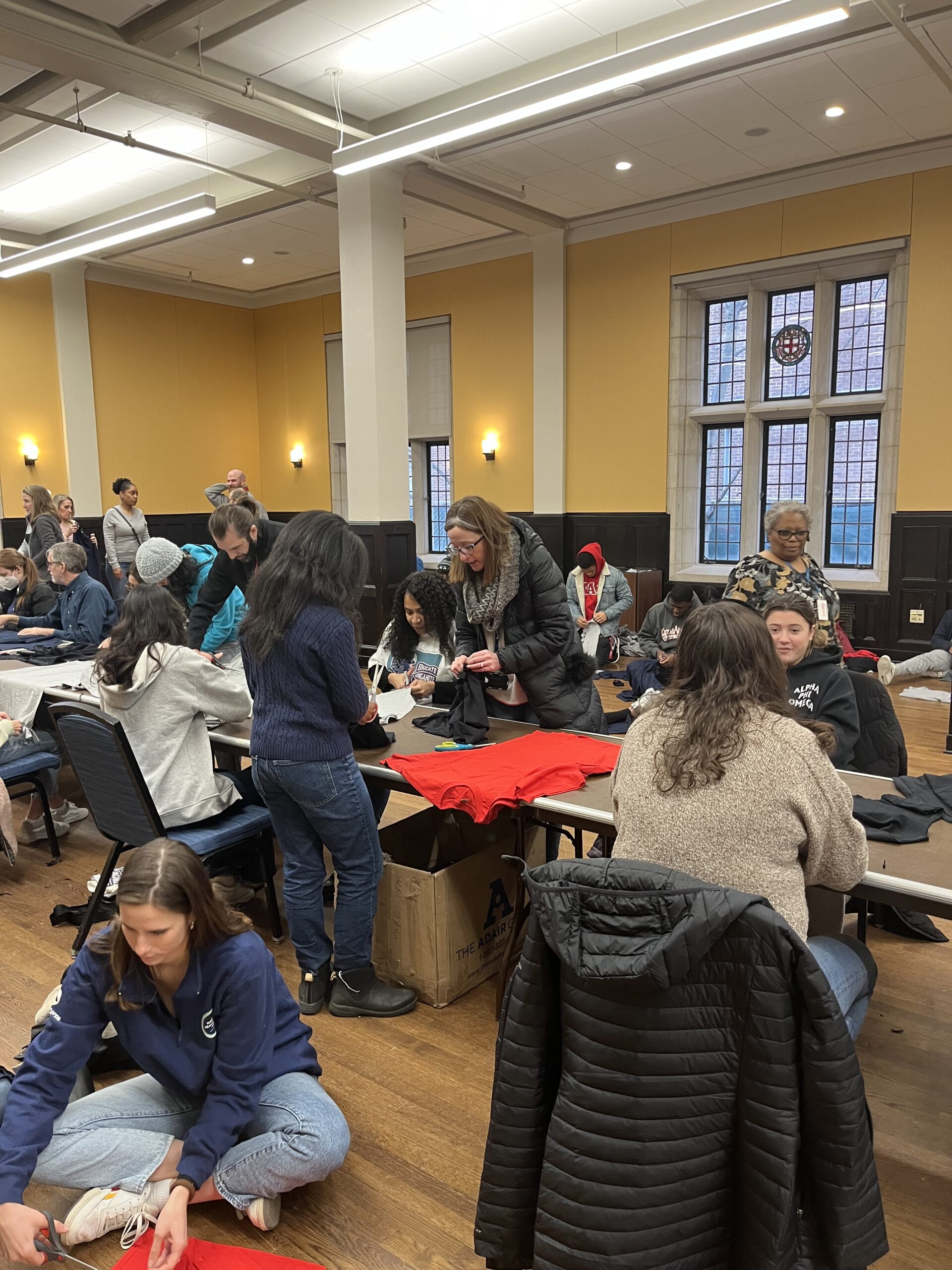 VP Anderson packaging donations at a volunteer event in Houston Hall.