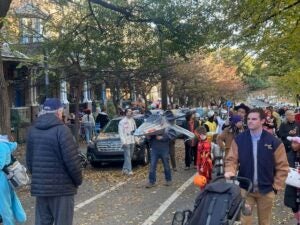 trick-or-treaters greet the Police trunk